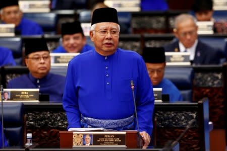 FILE PHOTO: Malaysia's Prime Minister Najib Razak presents the 2018 budget at the parliament house in Kuala Lumpur, Malaysia October 27, 2017. REUTERS/Lai Seng Sin