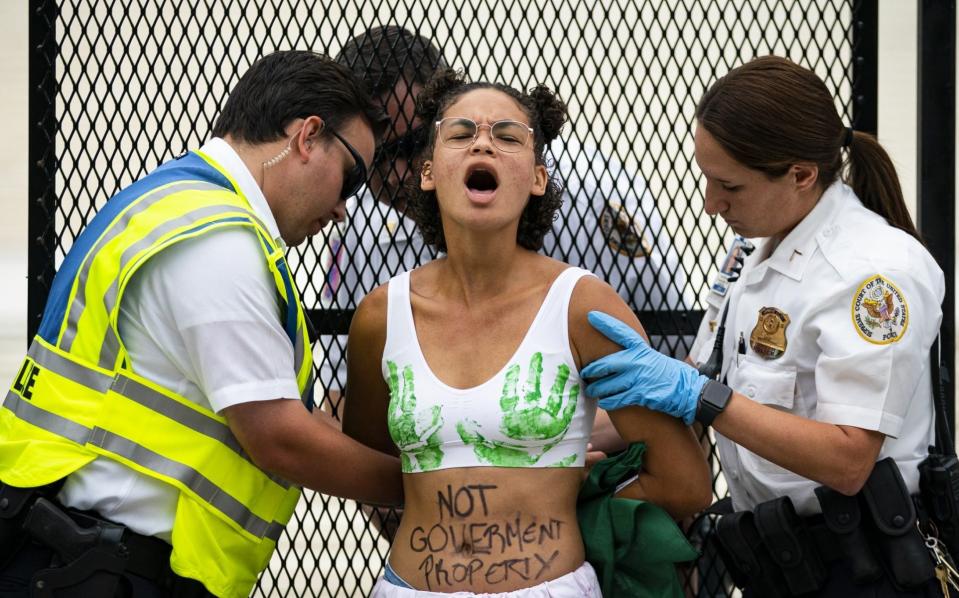 An abortion rights protester outside the Supreme Court in Washington - Al Drago /Bloomberg