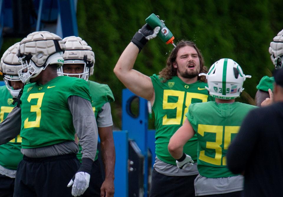 Oregon defensive lineman Casey Rogers cools off during practice with the Ducks Wednesday, Aug. 17, 2022. 