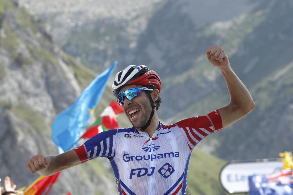 France's Thibaut Pinot celebrates as he crosses the finish line to win the fourteenth stage of the Tour de France cycling race over 117.5 kilometers (73 miles) with start in Tarbes and finish at the Tourmalet pass, France, Saturday, July 20, 2019. (AP Photo/ Thibault Camus)