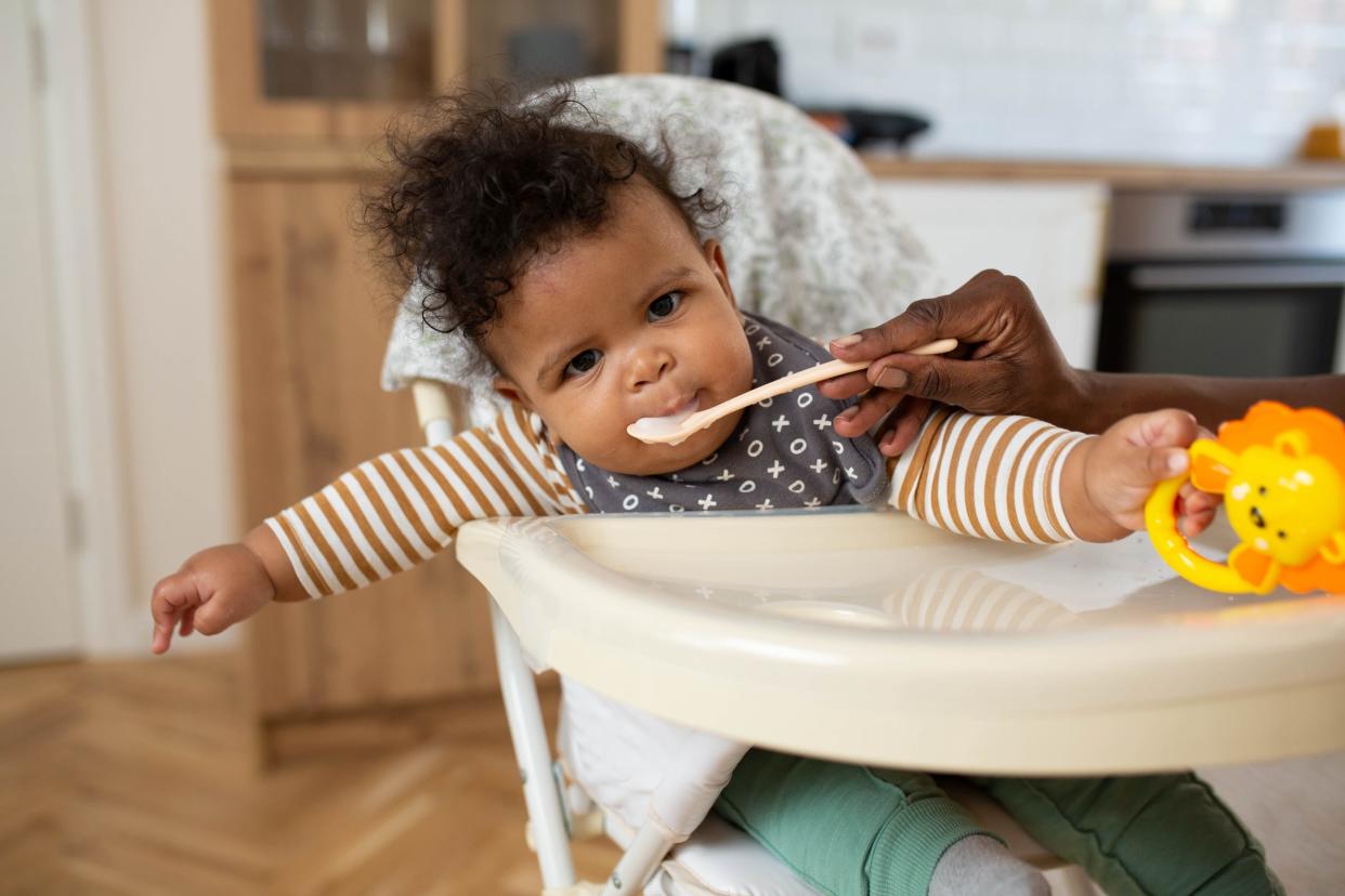 Baby eating solids for the first time