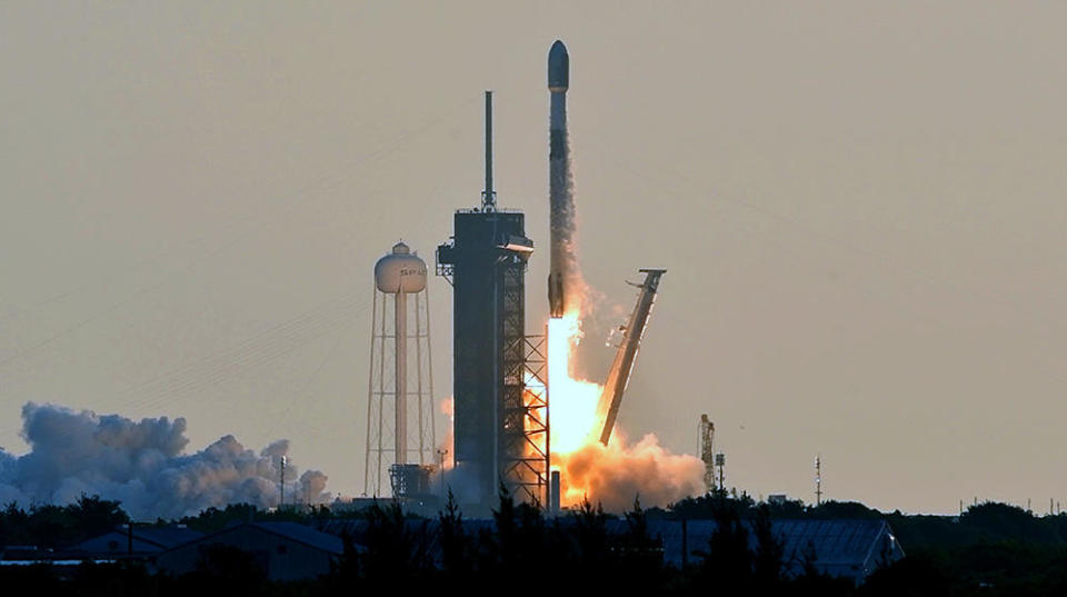 A few hours before the Atlas 5 was rolled to its launch pad at the Cape Canaveral Space Force Station, SpaceX launched a Falcon 9 rocket from a nearby Kennedy Space Center pad, boosting 53 Starlink internet satellites into orbit. / Credit: William Harwood/CBS News