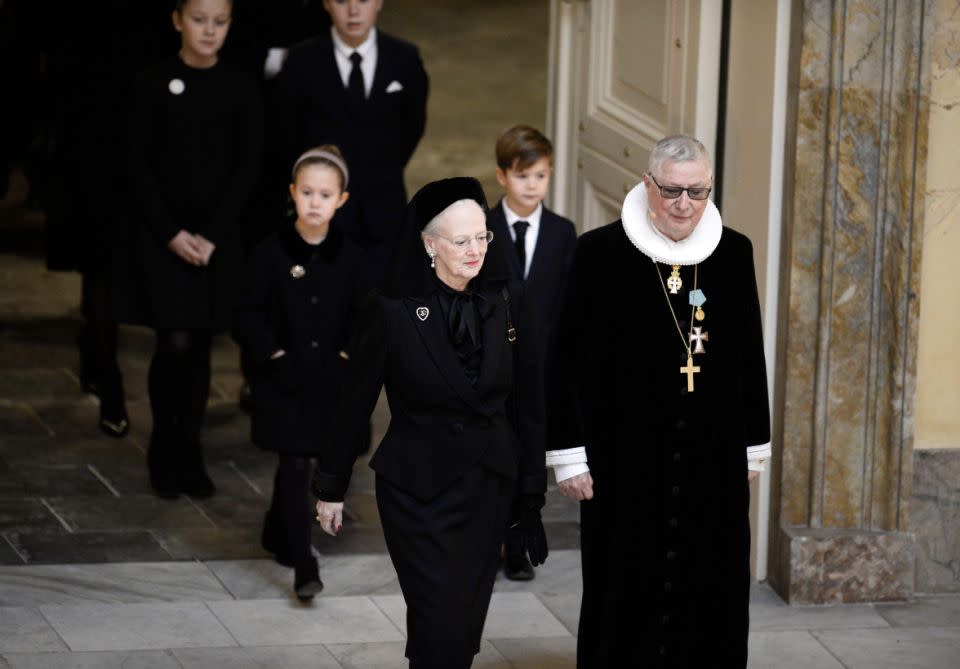 Henrik's widow the Queen walked in ahead of her grandchildren. Photo: Getty