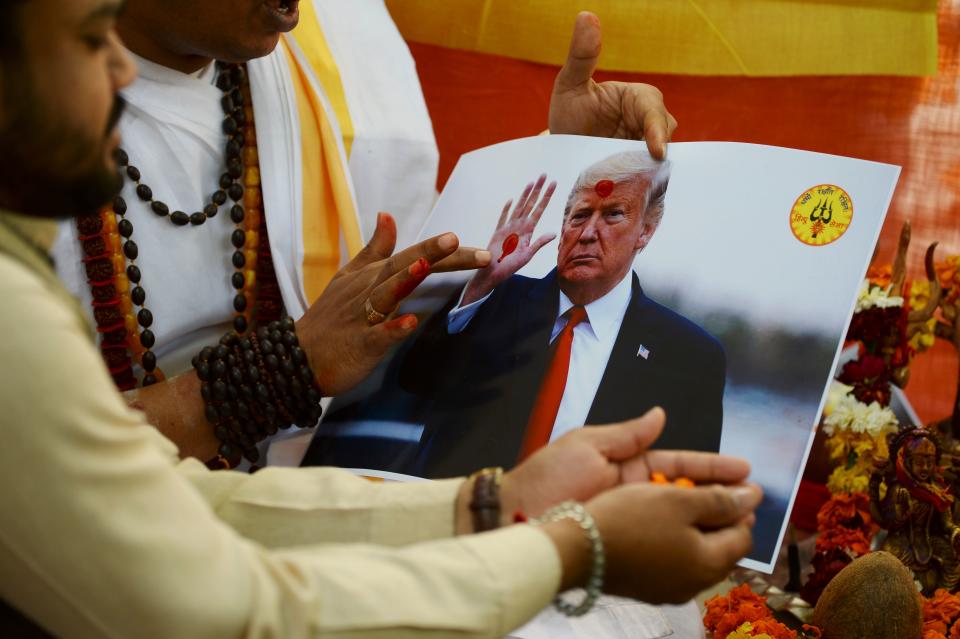 Hindu priests perform rituals during prayers organised by Hindu Sena, a far-right Hindu group, seeking blessings from gods and to unite India and the United States of America against radical Islamic fanatics, in New Delhi on February 24, 2020, on the occasion of US President Donald Trump first official visit to India. (Photo by Sajjad HUSSAIN / AFP) (Photo by SAJJAD HUSSAIN/AFP via Getty Images)