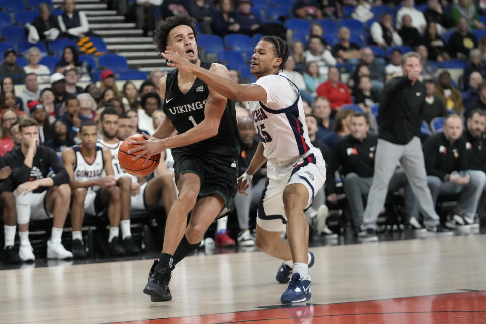 Gonzaga guard Rasir Bolton (45) defends against Portland State guard Cameron Parker (1) during the first half of an NCAA college basketball game in the Phil Knight Legacy tournament Thursday, Nov. 24, 2022, in Portland, Ore. (AP Photo/Rick Bowmer)