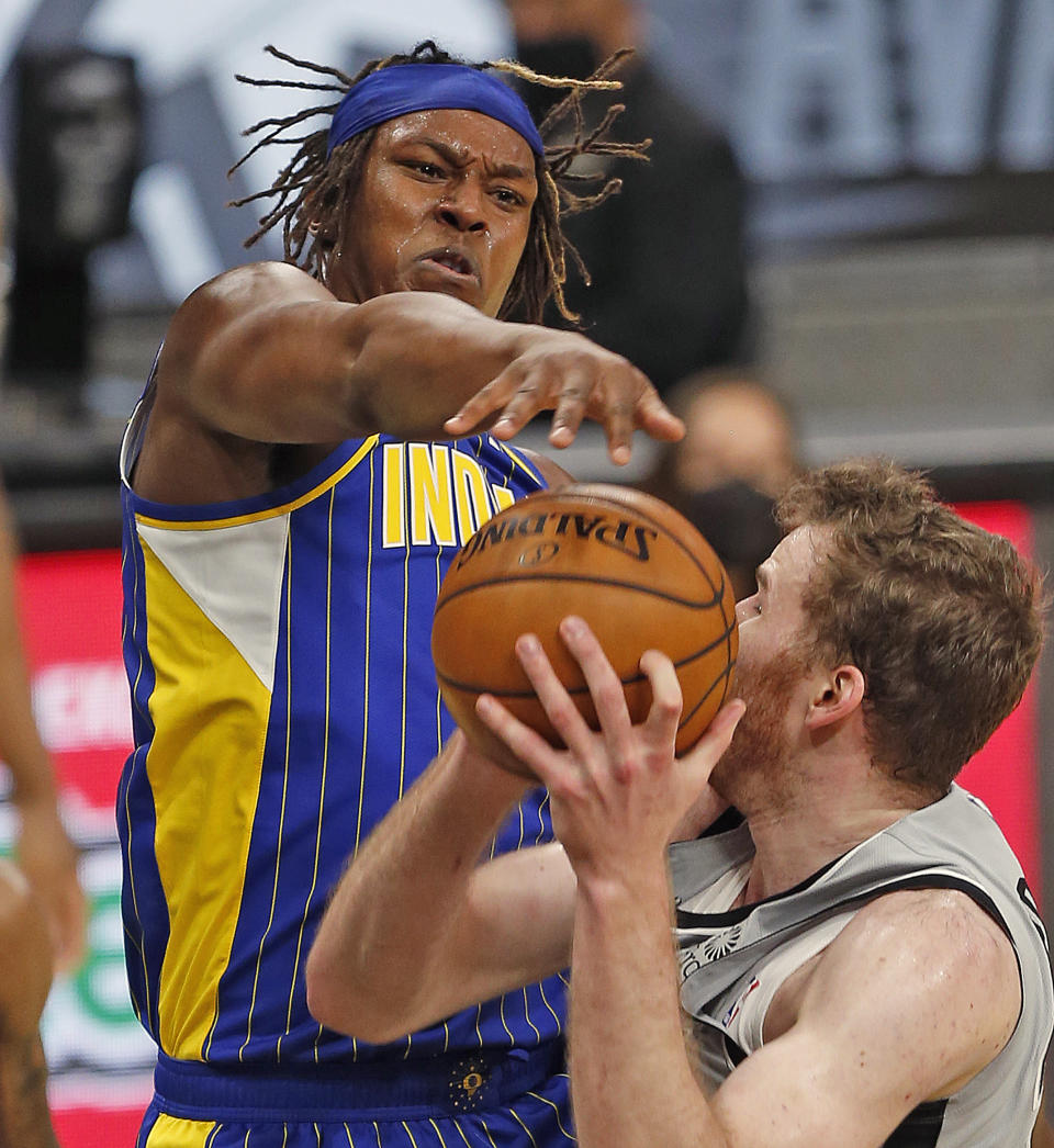 SAN ANTONIO, TX - APRIL 03: Myles Turner #33 of the Indiana Pacers blocks shot of Jakob Poeltl #25 of the San Antonio Spurs in the first half at AT&T Center on April 3, 2021 in San Antonio, Texas.  NOTE TO USER: User expressly acknowledges and agrees that, by downloading and or using this photograph, User is consenting to the terms and conditions of the Getty Images License Agreement. (Photo by Ronald Cortes/Getty Images)