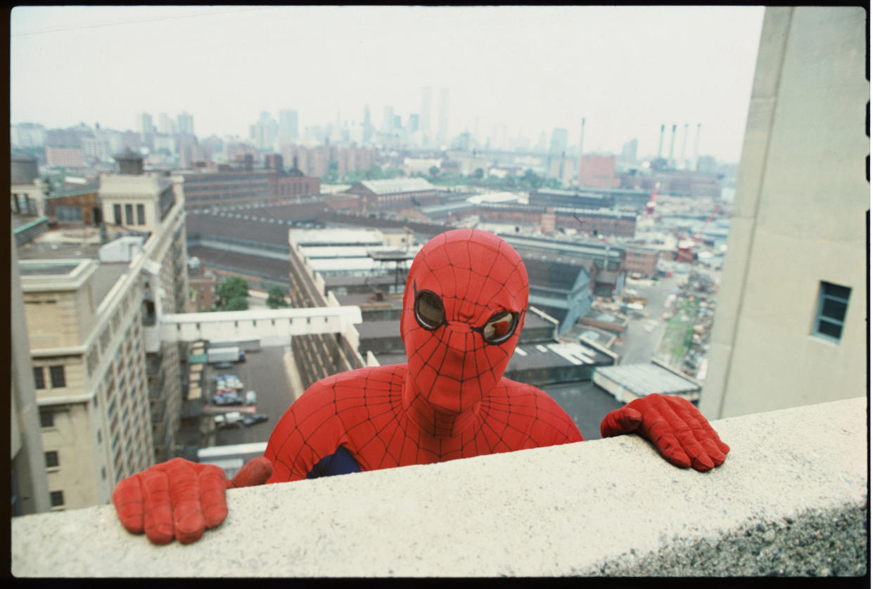 Promotional portrait of American actor Nicholas Hammond, as the costumed superhero Spider-man, as he peers over the edge of a window sill on the CBS television series 'The Amazing Spider-Man,' 1978. The series was based on a long-running comic book, developed by Stan Lee and Steve Ditko. (Photo by CBS Photo Archive/Getty Images)