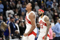 Toronto Raptors forward Scottie Barnes (4) reacts after scoring late in the second half of an NBA basketball game against the Memphis Grizzlies, Sunday, Feb. 5, 2023, in Memphis, Tenn. The Raptors won 106-103. (AP Photo/Brandon Dill)