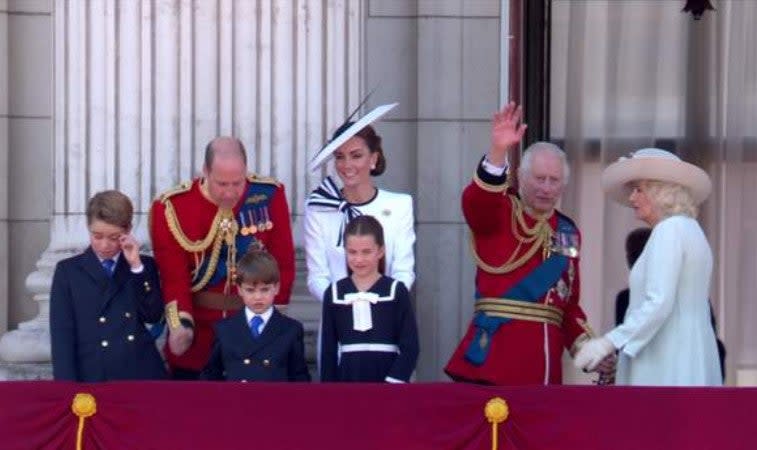 Members of the Royal Family waving to the crowds after the fly-past (BBC)