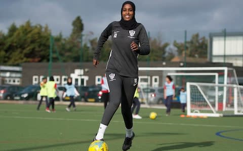 Iqra Ismail dribbling a football at training - 'I realised the world really is against me' – the black women shaking up football - Credit: EDDIE MULHOLLAND