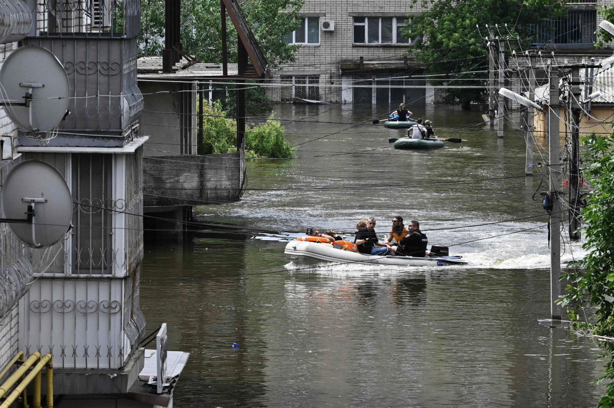 Ukraine and Russia accused each other of shelling in the flood-hit Kherson region on June 8, 2023 even as rescuers raced to save people stranded after the destruction of a Russian-held dam unleashed a torrent of water.  (Genya Savilov / AFP - Getty Images)