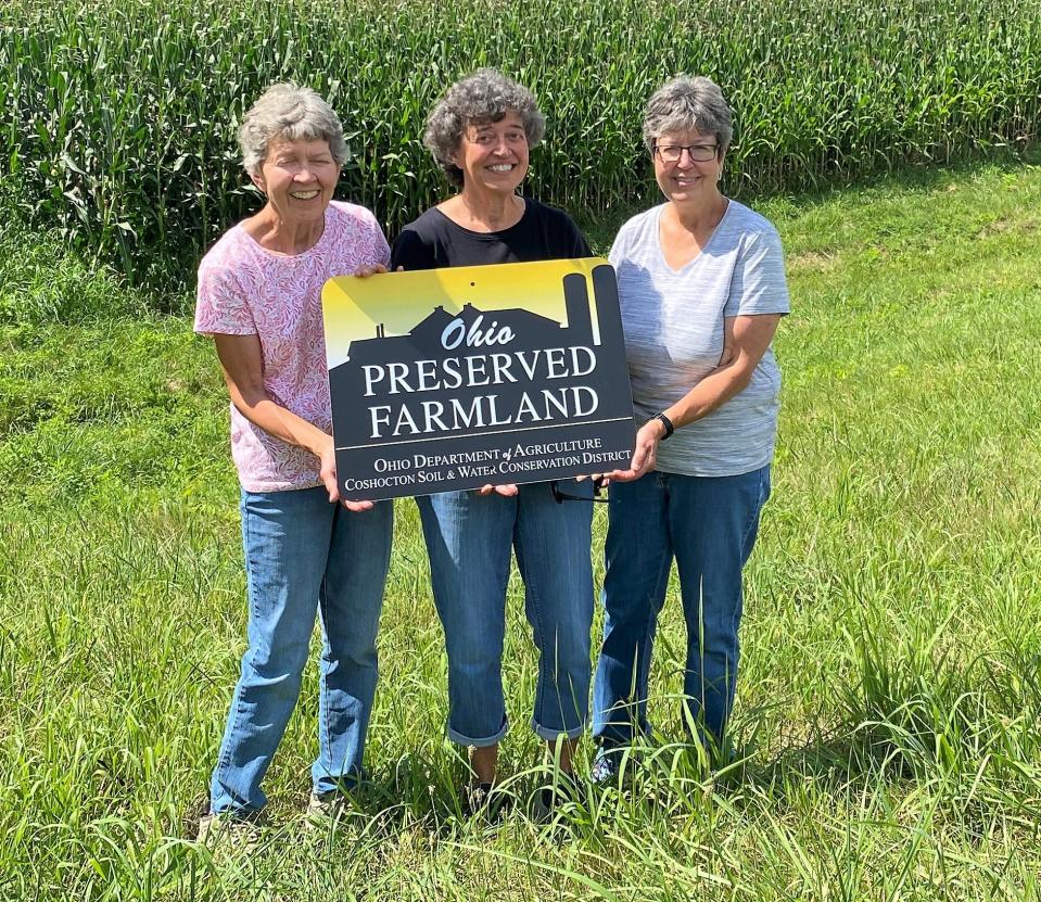 Susan Fleck, Ann Herman and Barb Porteus recently had 93 acres of farmland that has been in their family for about 175 years put into the Ohio Department of Agriculture's Farmland Preservation Program to keep it in agriculture for generations to come.