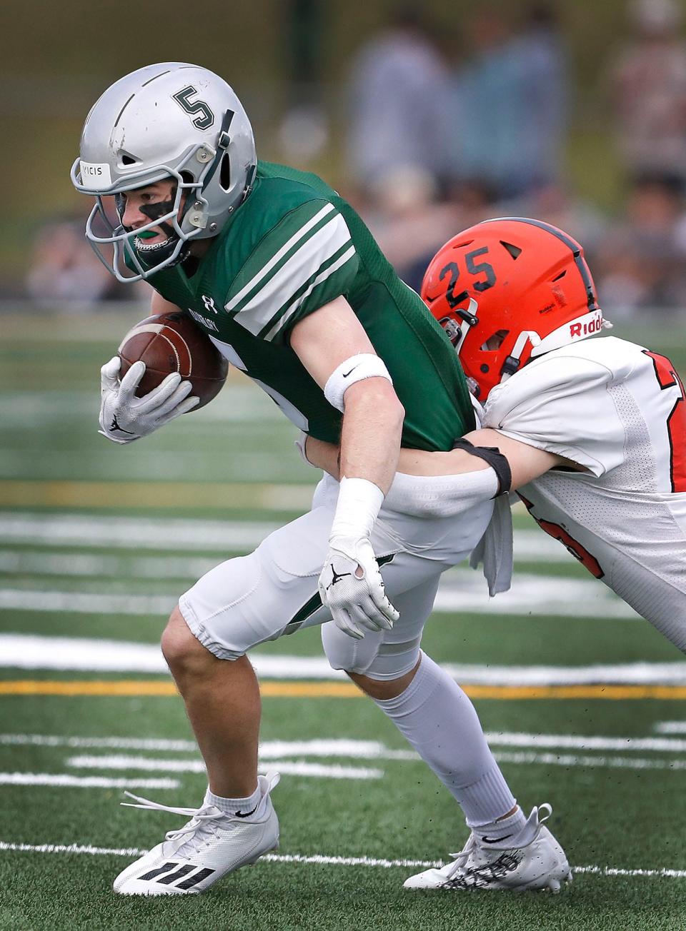 Duxbury #5 senior captain Chris Walsh fights for a few extra yards with Middleboro's Jack Kavaleski on his back.
The Duxbury Dragons hosted the Middleboro Sachems in MIAA football tournament action on Friday November 11, 2022.