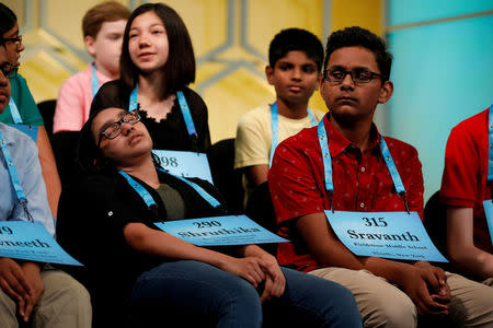 Shruthika Padhy relaxes between rounds during the Scripps National Spelling Bee at National Harbor in Oxon Hill, Maryland, U.S., May 31, 2018. REUTERS/Aaron P. Bernstein