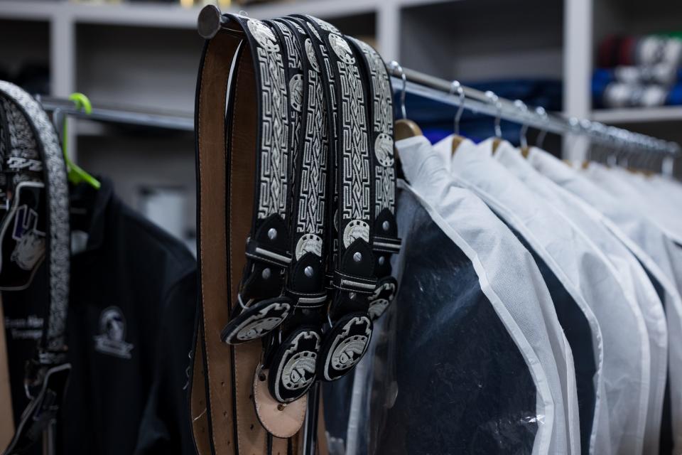 Franklin High School students hang their belts and belt buckles. Mariachi Estrella Del Oeste is one of the four El Paso Independent School District high schools that have secured spots in the 2024 UIL State Mariachi Festival.