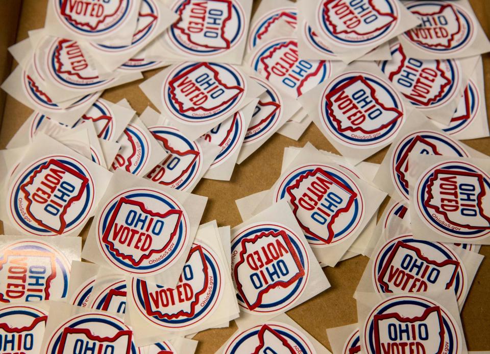 Voting stickers rest in a box at the exit of the Hamilton County Board of Elections early voting facility in Norwood.