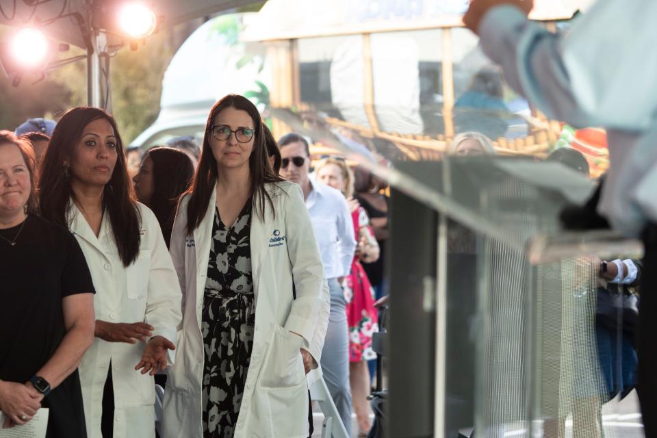 Dr. Meena Iyer and Dr. Melissa Cossey stand to be recognized during the Dell Children’s North Campus community open house.