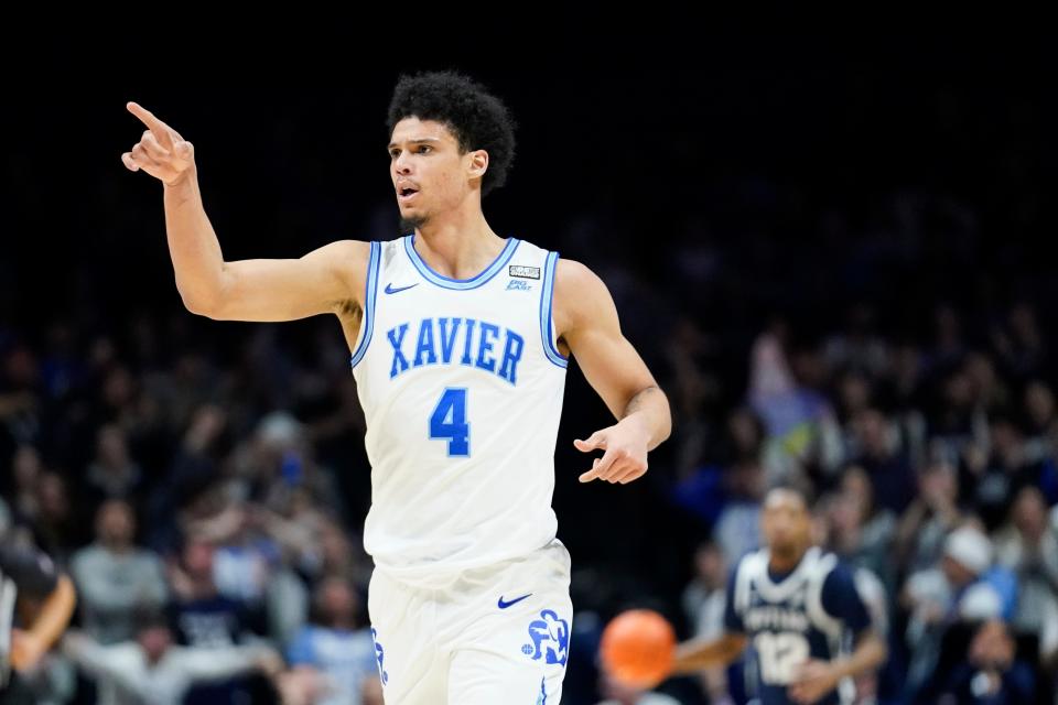 Xavier forward Cesare Edwards (4) reacts after scoring during the first half of an NCAA college basketball game against Butler, Saturday, March 4, 2023, in Cincinnati. (AP Photo/Joshua A. Bickel)