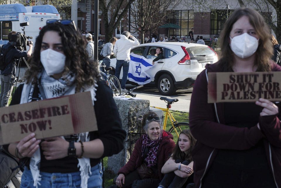 Ahlam Abuawad, left, and Emily Simpson, listen to a speaker during a pro-Palestinian protest on the Dartmouth College Green in Hanover, N.H., on Wednesday, May 1, 2024. (James M. Patterson/Valley News via AP)