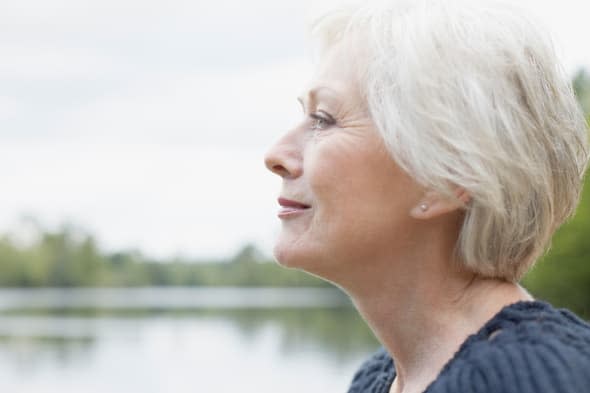 Senior woman near lake