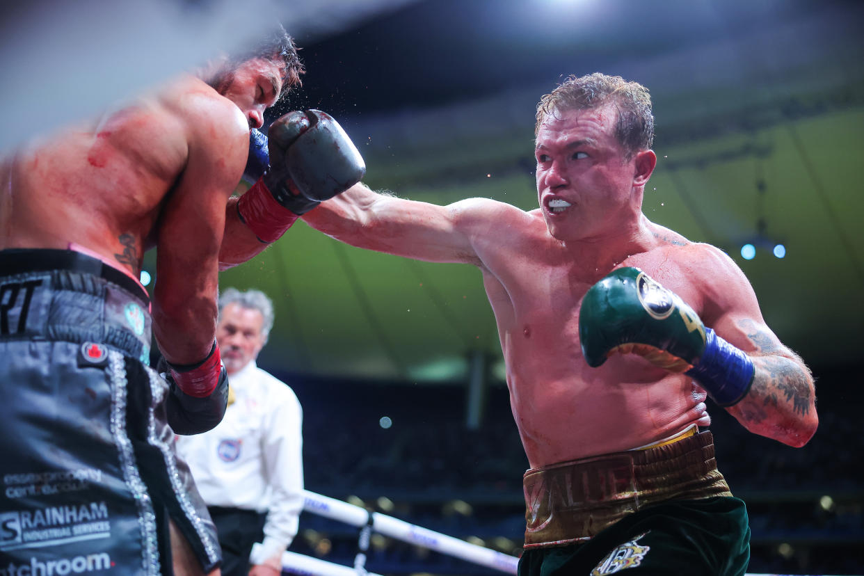 ZAPOPAN, MEXICO - MAY 06: Canelo Alvarez of Mexico punches John Ryder of Great Britain during the fight for the Super Middleweight Championship at Akron Stadium on May 06, 2023 in Zapopan, Mexico. (Photo by Hector Vivas/Getty Images)