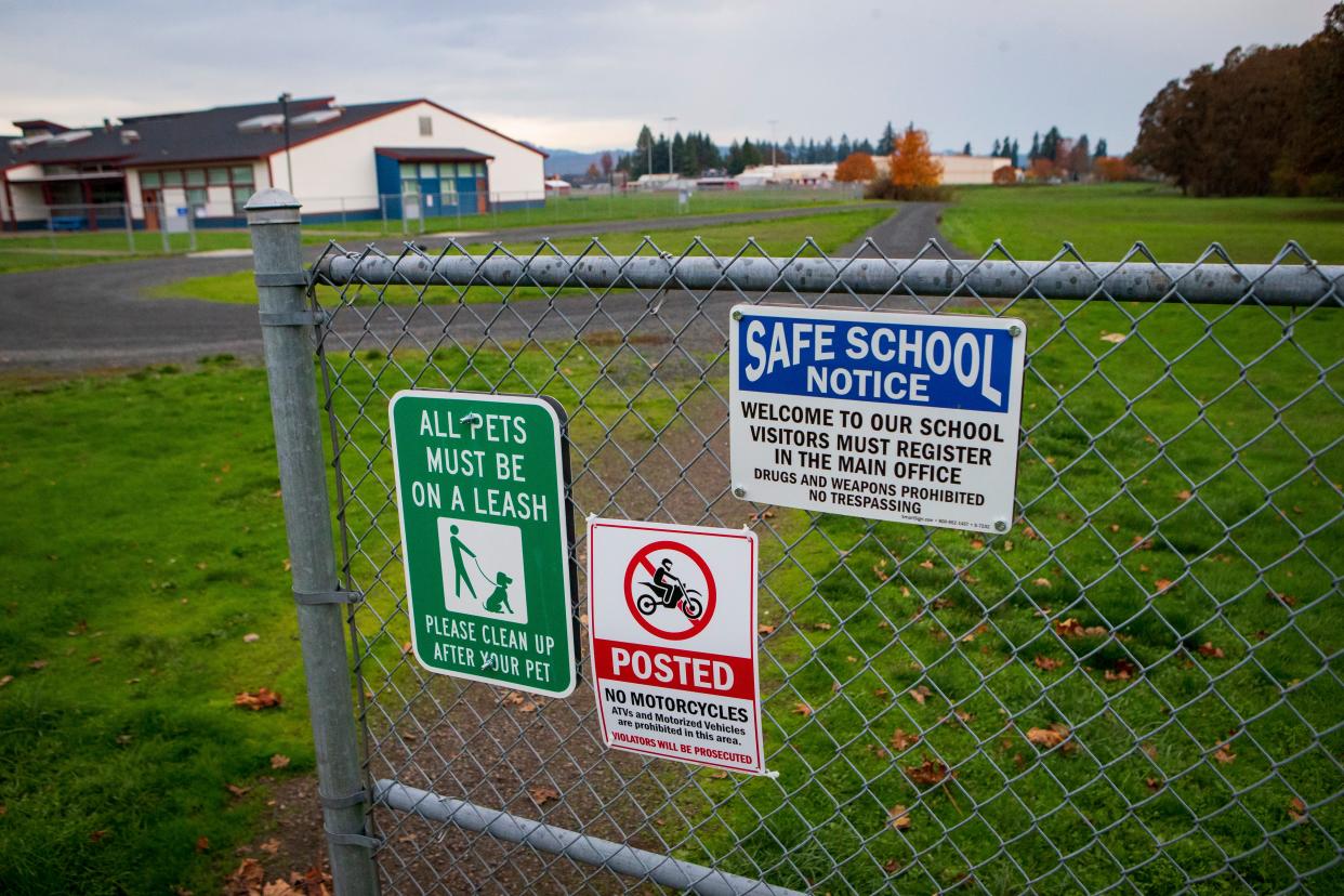 A fence blocks a section of Creswell School District property near Creslane Elementary School.