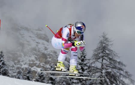 Lindsey Vonn of the U.S. is airborne as she clears a gate to win the women's World Cup Downhill skiing race in Cortina D'Ampezzo January 18, 2015. REUTERS/Stringer