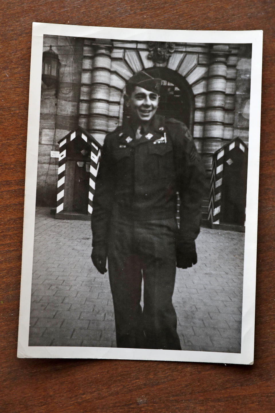 In this 1945 or 1946 photograph provided by Emily DiPalma Aho, Emily DiPalma Aho's father, Emilio DiPalma, stands outside the Palace of Justice in Nuremberg, Germany. Emilio died last month at the age of 93 after contracting the coronavirus at Holyoke Soldiers' Home in Massachusetts. (Courtesy of Emily DiPalma Aho via AP)