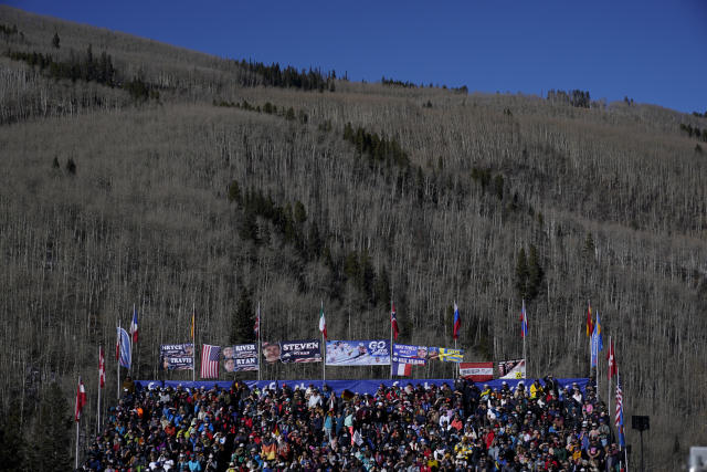 FILE - Skiing fans look on from bleachers before the World Cup downhill ski racing on Dec. 4, 2021, in Beaver Creek, Colo. Olympic athletes in Alpine skiing and other outdoor sports dependent on snow are worried as they see winters disappearing. (AP Photo/Gregory Bull, File)