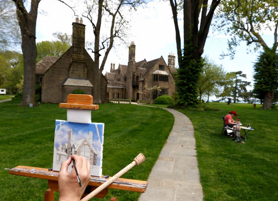 Donald Cronkite, 55 of Allen Park, paints The Edsel and Eleanor Ford House in Grosse Pointe Shores on May 14, 2022.