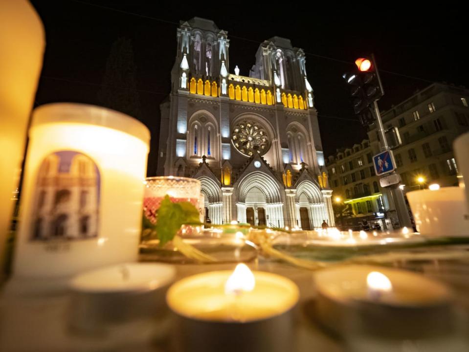 <div class="inline-image__caption"><p>People pay tribute at night in front of Notre Dame Basilica on October 29, 2020 in Nice, France</p></div> <div class="inline-image__credit">Arnold Jerocki/Getty Images</div>