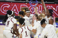 South Carolina celebrates after an NCAA college basketball game against Georgia,Sunday, March 7, 2021, during the Southeastern Conference tournament final in Greenville, S.C. (AP Photo/Sean Rayford)