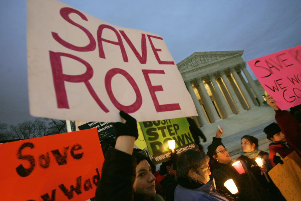 Pro-choice supporters hold a candlelight vigil infront of the Supreme Court Building Sunday, Jan. 22, 2005 in Washington. It was 33-years ago today that the Supreme Court decision of Roe versus Wade made abortion legal. (AP Photo/Pablo Martinez Monsivais)