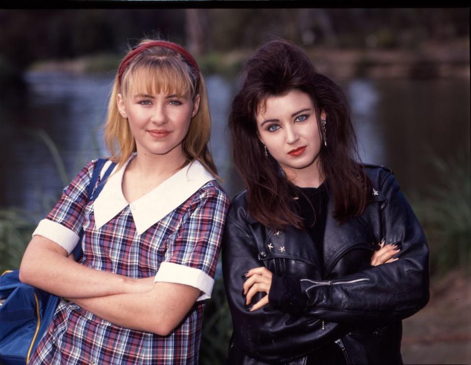 home and away, dannii minogue with black 80s hair and a leather jacket