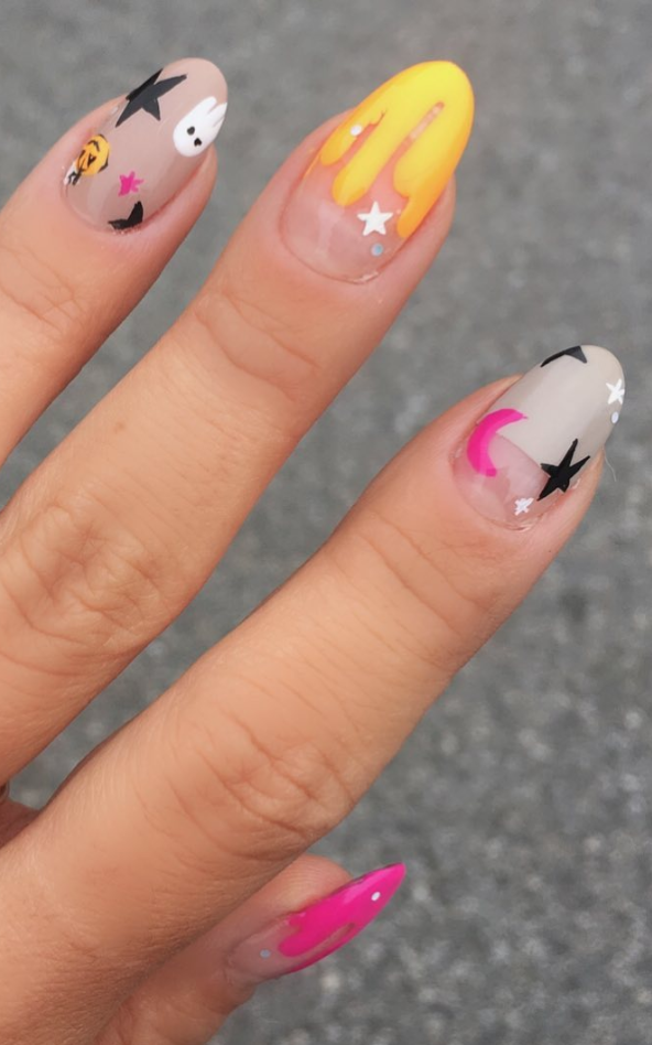 <p>Do a colorful drippy tip, with pumpkins, ghosts, and decorative stars for this fun <a href="https://www.instagram.com/p/B3zaMtXj07Z/" rel="nofollow noopener" target="_blank" data-ylk="slk:manicure by nail artist Nina Park;elm:context_link;itc:0;sec:content-canvas" class="link ">manicure by nail artist Nina Park</a>. Don't think you can freehand paint the little designs? Don't sweat it, there are nail stickers for that.</p><p><a class="link " href="https://www.amazon.com/Madholly-Adhesive-Halloween-Decoration-Fingernails/dp/B07GWPGNX8/?tag=syn-yahoo-20&ascsubtag=%5Bartid%7C10072.g.33239588%5Bsrc%7Cyahoo-us" rel="nofollow noopener" target="_blank" data-ylk="slk:SHOP NAIL STICKERS;elm:context_link;itc:0;sec:content-canvas">SHOP NAIL STICKERS</a></p>