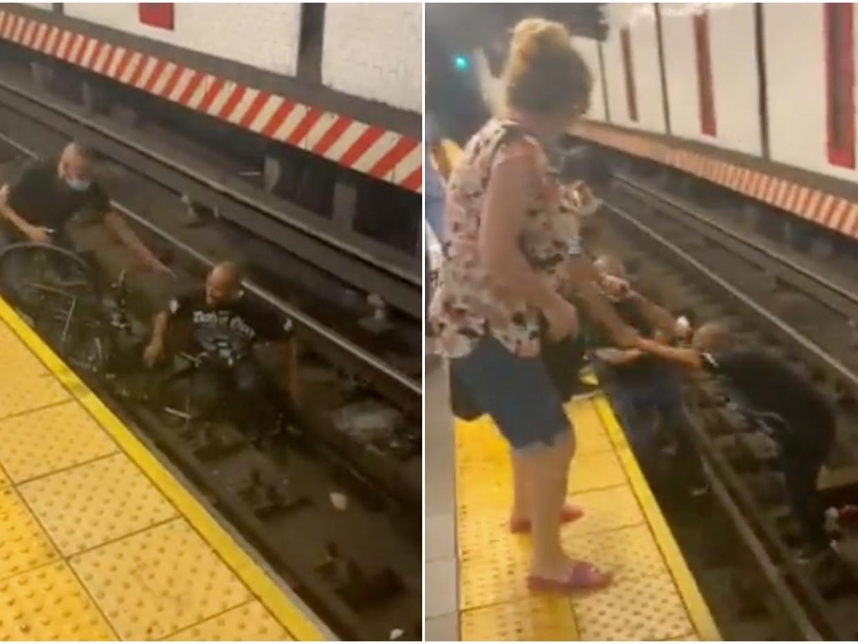 Commuters help wheelchair users off of NYC subway tracks