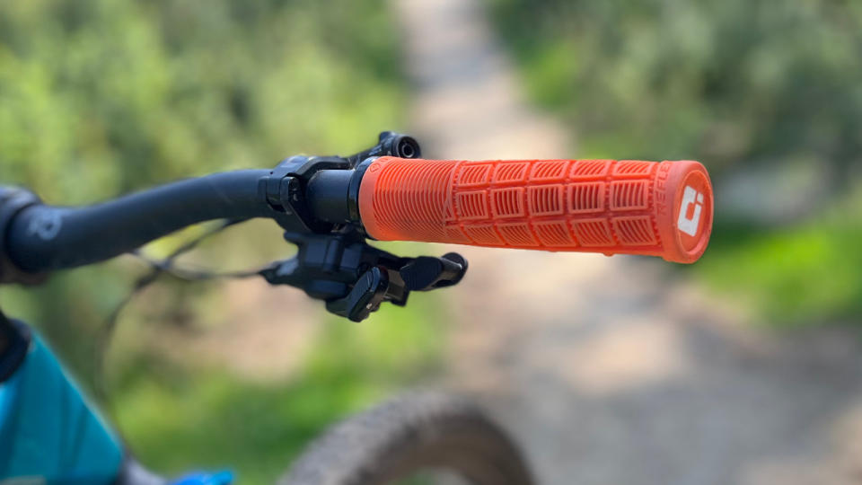 Orange ODI Reflex grip on bike handlebar