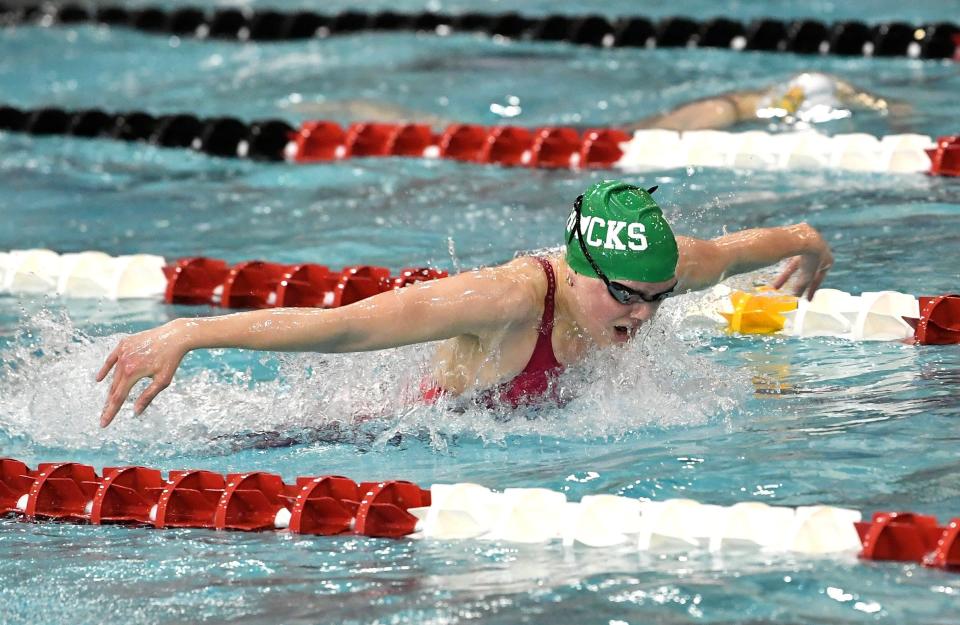 Emily Brown of Dublin Coffman swims her way to a second first-place medal as she wins the 100-yard butterfly in the Division I state meet Saturday in Canton.