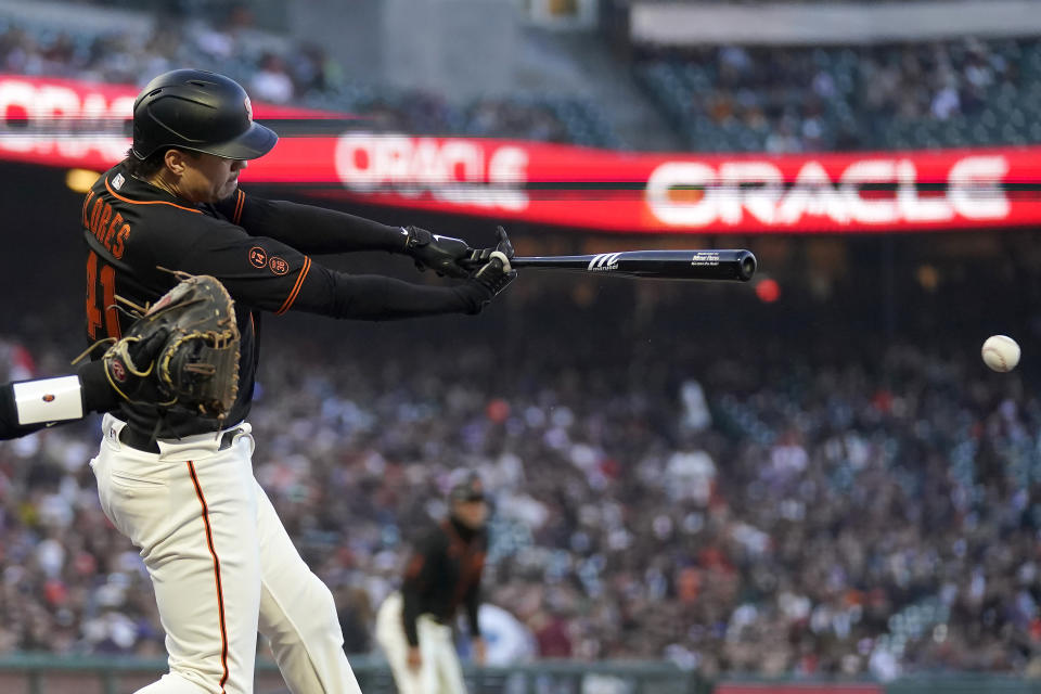 San Francisco Giants' Wilmer Flores hits a two-run single against the Baltimore Orioles during the third inning of a baseball game in San Francisco, Saturday, June 3, 2023. (AP Photo/Jeff Chiu)