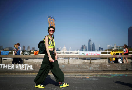 A climate change activist attends an Extinction Rebellion protest in London, Britain April 21, 2019. REUTERS/Hannah McKay