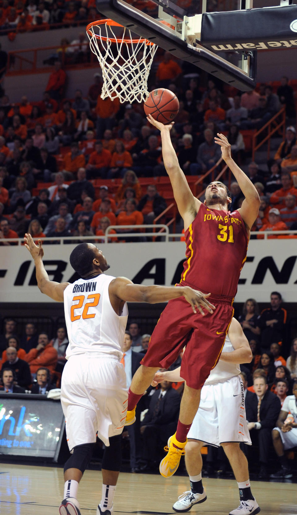 Iowa State's Georges Niang (31) takes a shot over Oklahoma State's Markel Brown (22) during the first half of an NCAA college basketball game in Stillwater, Okla., Monday, Feb. 3, 2014. (AP Photo/Brody Schmidt)