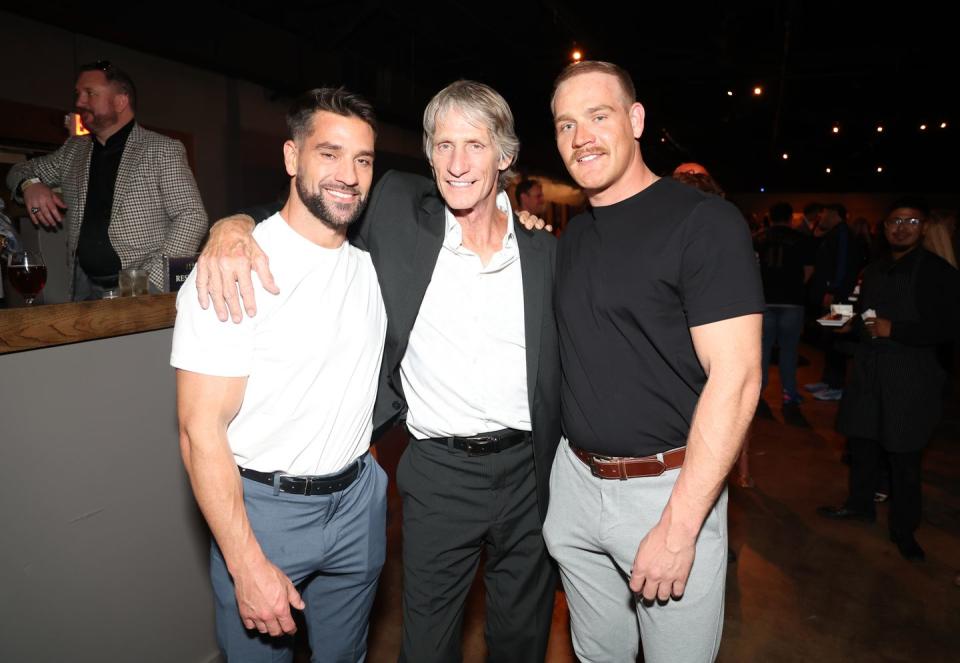 kevin von erich embracing his sons for a photo