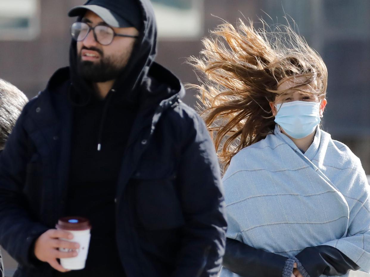 Pedestrians face windy conditions as they cross London Bridge in central London over the weekend (AFP via Getty Images)