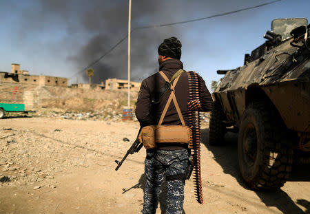 A member of the Iraqi security forces is pictured during a battle with Islamic State militants in west Mosul, Iraq. REUTERS/Zohra Bensemra