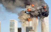 A fiery blasts rocks the World Trade Center after being hit by two planes September 11, 2001 in New York City. (Photo by Spencer Platt/Getty Images)