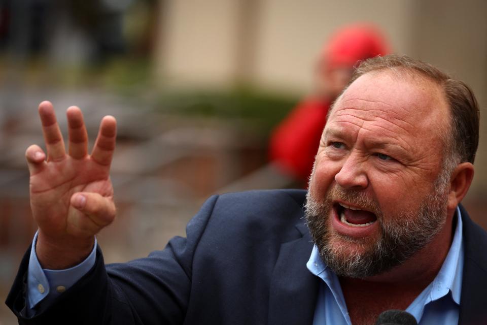 Alex Jones speaks to reporters outside his Sandy Hook defamation trial in Waterbury, Connecticut, on Tuesday (REUTERS)