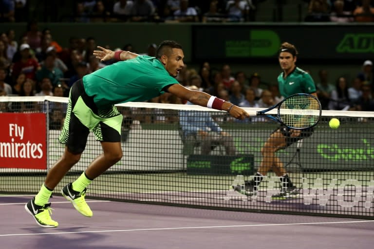 Nick Kyrgios of Australia stretches for a shot against Roger Federer of Switzerland in the semi-finals at the Miami Open