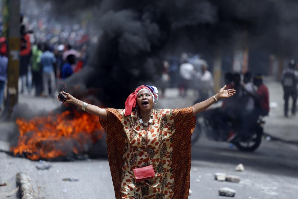 A protester yells anti-government slogans in Port-au-Prince, Haiti, Sunday, June 9, 2019. Protesters denouncing corruption paralyzed much of the capital as they demanded the removal of President Jovenel Moise. (AP Photo/Dieu Nalio Chery)