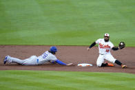 Baltimore Orioles second baseman Rougned Odor (12) catches a throw from catcher Robinson Chirinos, not visible, while trying to pick off Texas Rangers' Jonah Heim, left, at second base during the second inning of a baseball game, Tuesday, July 5, 2022, in Baltimore. (AP Photo/Julio Cortez)