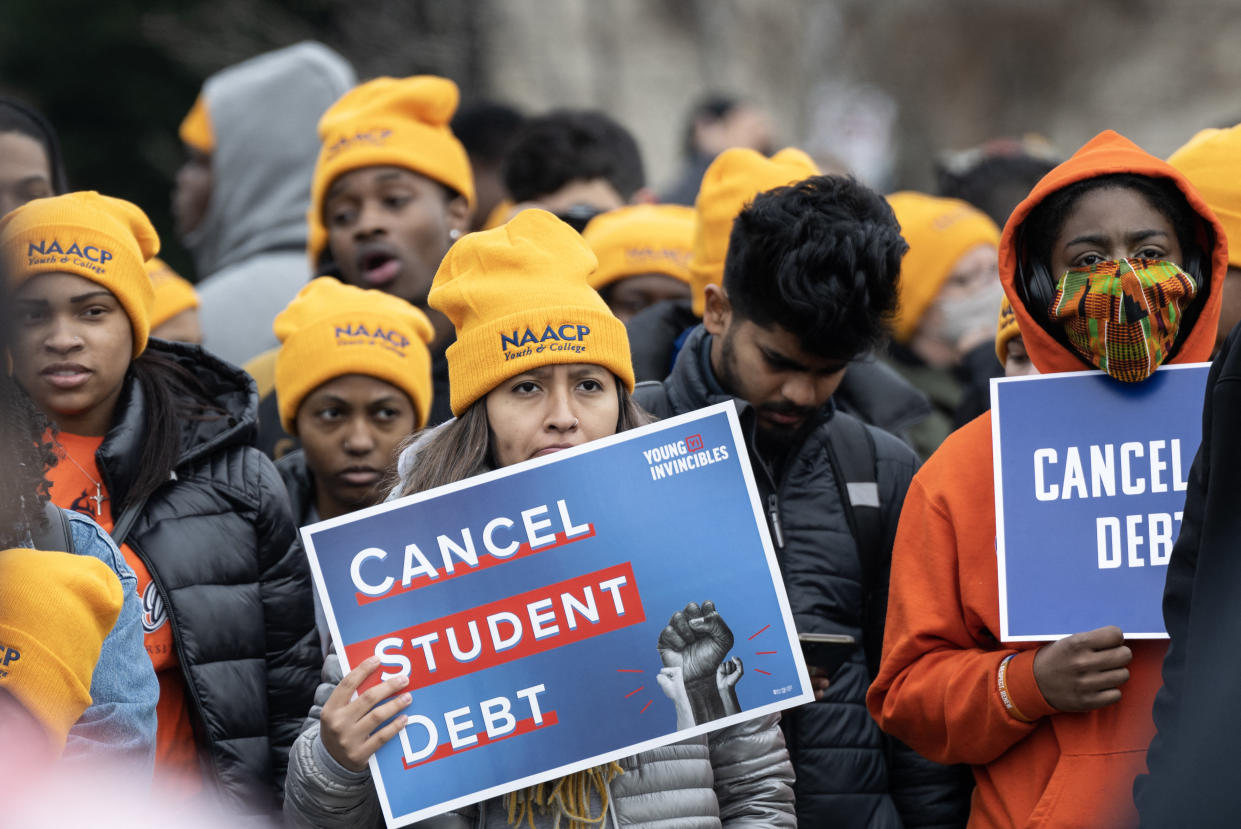 TOPSHOT - Activists and students protest in front of the Supreme Court during a rally for student debt cancellation in Washington, DC, on February 28, 2023. - The court begins oral arguments in two cases, one from six Republican-led states, that challenge US President Joe Biden&#39;s student debt forgiveness policy. (Photo by ANDREW CABALLERO-REYNOLDS / AFP) (Photo by ANDREW CABALLERO-REYNOLDS/AFP via Getty Images)